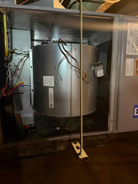 Blower motor assembly inside an open air handler