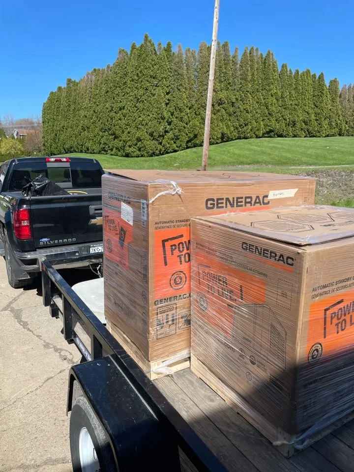 Generac standby generators loaded on a Hanson Electric project trailer
